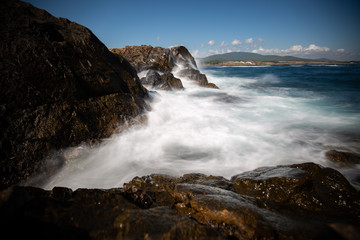 waves breaking on the rocks