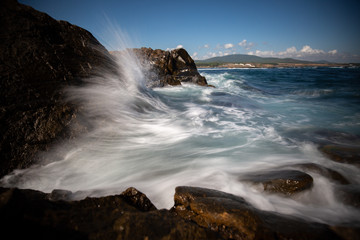 waves breaking on the rocks