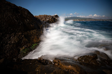 waves breaking on the rocks