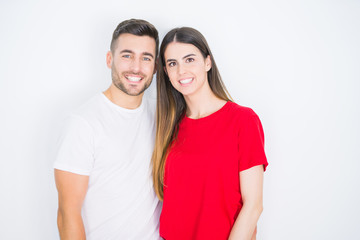 Fototapeta premium Young beautiful couple together over white isolated background with a happy and cool smile on face. Lucky person.