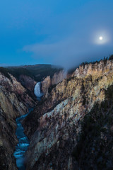 Lower falls and the Grand Canyon at night with full moon, Yellowstone National Park, Wyoming, USA