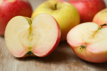 Group of  fresh ripe red apples with sliced portions close up 