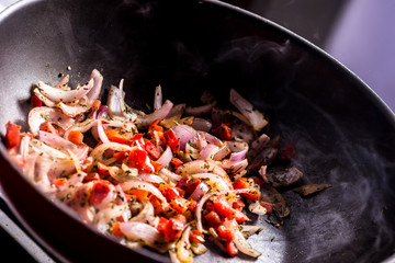 Cooking vegetables on a wok