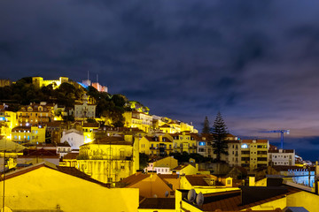 Aerial view of Lisbon, Portugal at nightwith view over old Alfama and fortress