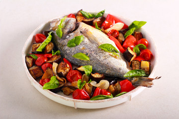 Baked whole mahi mahi fish with vegetables