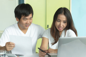 Comfort e-commerce shopping, Asian couple shopping online and payment by credit card.