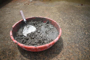 Cement Sand Concrete Water Mixture in a Tub with a Trowel