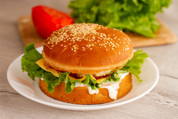 fresh homdemade sandwich in a white plate on the table