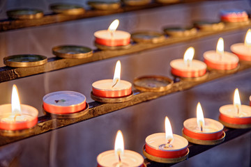 Burning candles inside Winchester Cathedral, Hampshire, England