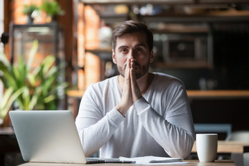 Thoughtful doubtful businessman in tension thinking make difficult decision