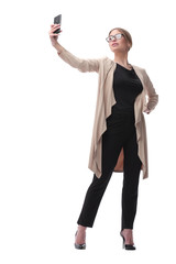 young trendy woman taking a selfie. isolated on white