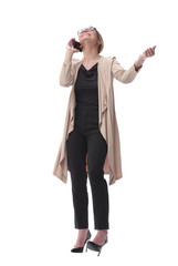 young serious woman talking on the phone. isolated on white