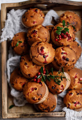 Freshly baked cowberry muffins. Cranberry muffins with fresh berries on rustic background. Copy space.