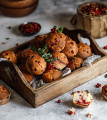 Freshly baked cowberry muffins. Cranberry muffins with fresh berries on rustic background. Copy...