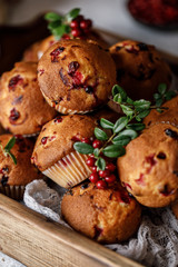 Freshly baked cowberry muffins. Cranberry muffins with fresh berries on rustic background. Copy space.