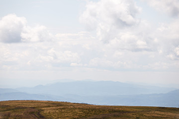 Cloudy sky on the background of mountains