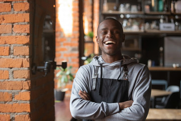 Happy confident african waiter small business owner portrait