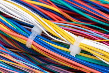 Bundle of colorful cabling with cable ties in telecommunication network