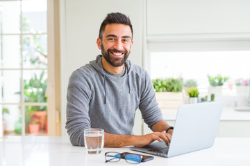 Fototapeta premium Man smiling working using computer laptop