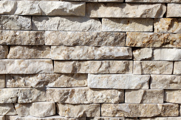 Masonry with natural stone cladding