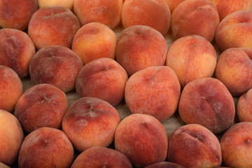 Fresh ripe peaches close-up. Wallpaper, background. Fruit season