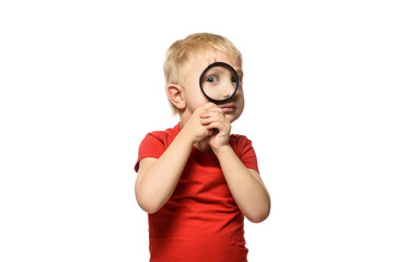 Blond boy with a magnifying glass in his hands. Little explorer. White background
