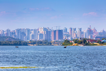 Summer sunny hot evening. Modern residential areas southern suburbs and midtown on hills in Kyiv on...