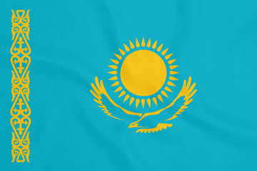 Flag of Kazakhstan on textured fabric. Patriotic symbol