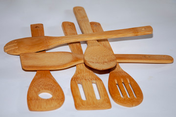 healthy light wooden kitchenware on a white background