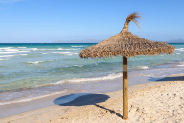 Umbrella at the Playa de Muro beach in Mallorca, Spain