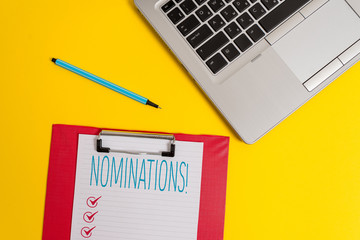 Writing note showing Nominations. Business concept for action of nominating or state being nominated for prize Trendy metallic laptop clipboard paper sheet marker colored background