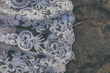 Lace dress detail on the beach