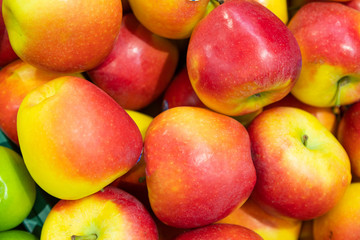 Colourful apple pile close-up, healthy snack option, fruit background