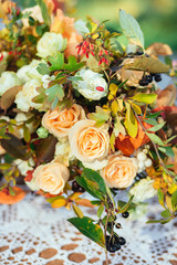 Autumn flowers decor, cream beige roses with fall berries