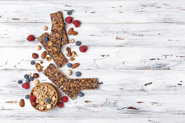 Granola bar with fresh berries and nuts for healthy nutrition