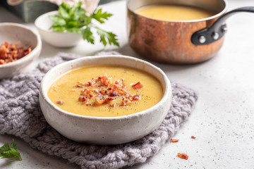 Lentil pea soup garnish with bacon and pork ribs