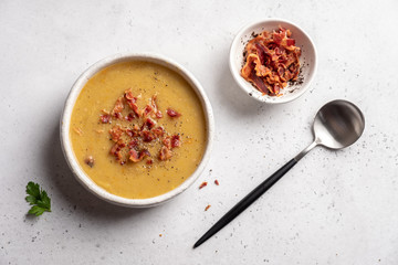 Lentil pea soup garnish with bacon and pork ribs