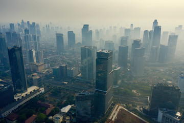 Fototapeta na wymiar Foggy Jakarta cityscape at morning time