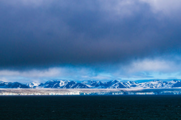 The end of a glacier in the Arctic Circle where it falls into the Arctic Ocean in Hornsund, Svalbard, Norway.