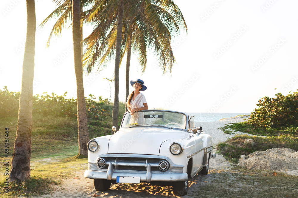 Poster happy young woman and retro convertible car