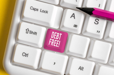 Word writing text Debt Free. Business photo showcasing does not owning any money to any individual or companies White pc keyboard with empty note paper above white background key copy space