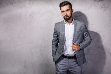 Handsome bearded man wearing gray suit
