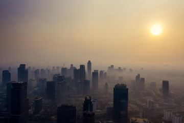 Jakarta city with air polluted at dusk time