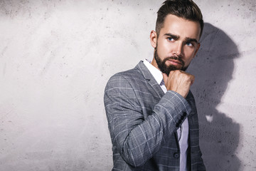 Handsome bearded man wearing gray suit