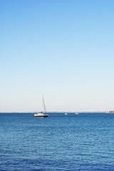 Obraz premium Fishing boats next to the Constitution Bridge, called La Pepa, on the coast of the capital city of Cádiz. Andalusia. Spain. Europe. August 12, 2019