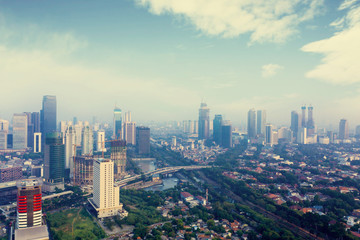 Fototapeta na wymiar Misty dense residential in Jakarta city at morning