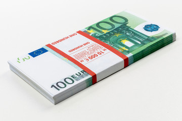 Euro cash in bundles of one hundred and two hundred banknotes, Euro money Euro on a white background, isolated on a white background