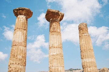 Fototapeta na wymiar Columns of old temple in the valley of temple in Agrigento, Sicily