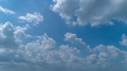 White and Dark Clouds Floating in the Bright Blue Skies