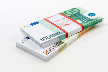 Euro cash in bundles of one hundred and two hundred banknotes, Euro money Euro on a white background, isolated on a white background